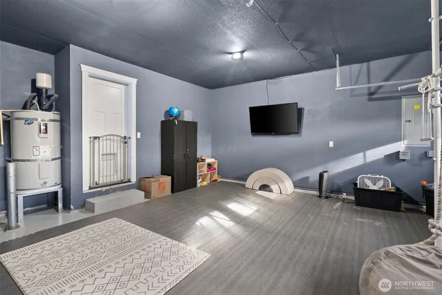 a view of a house with a yard and wooden fence