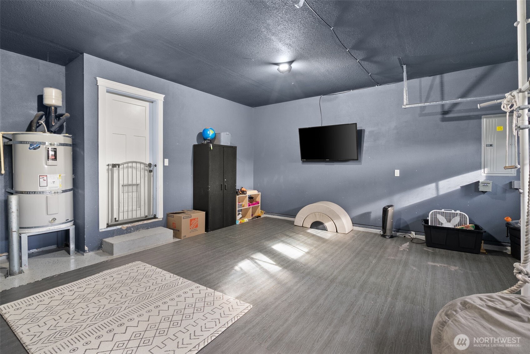 113 Ronge Roy, WA 98580 - Photo 27 of 40 a bedroom with furniture and a flat screen tv