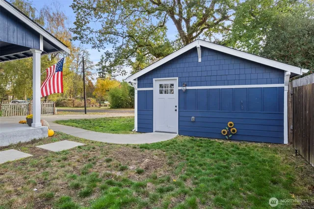 a front view of a house with garden