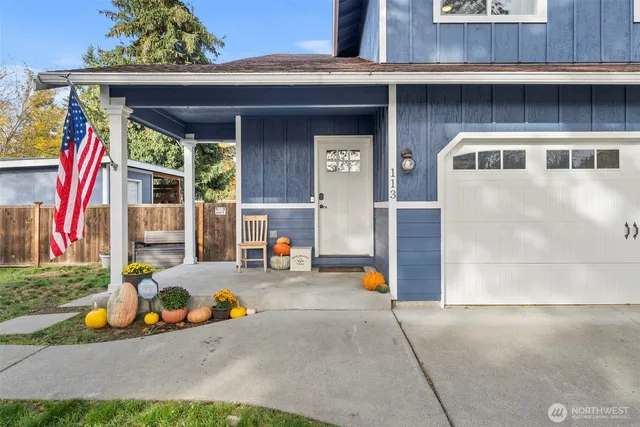 a front view of a house with outdoor seating