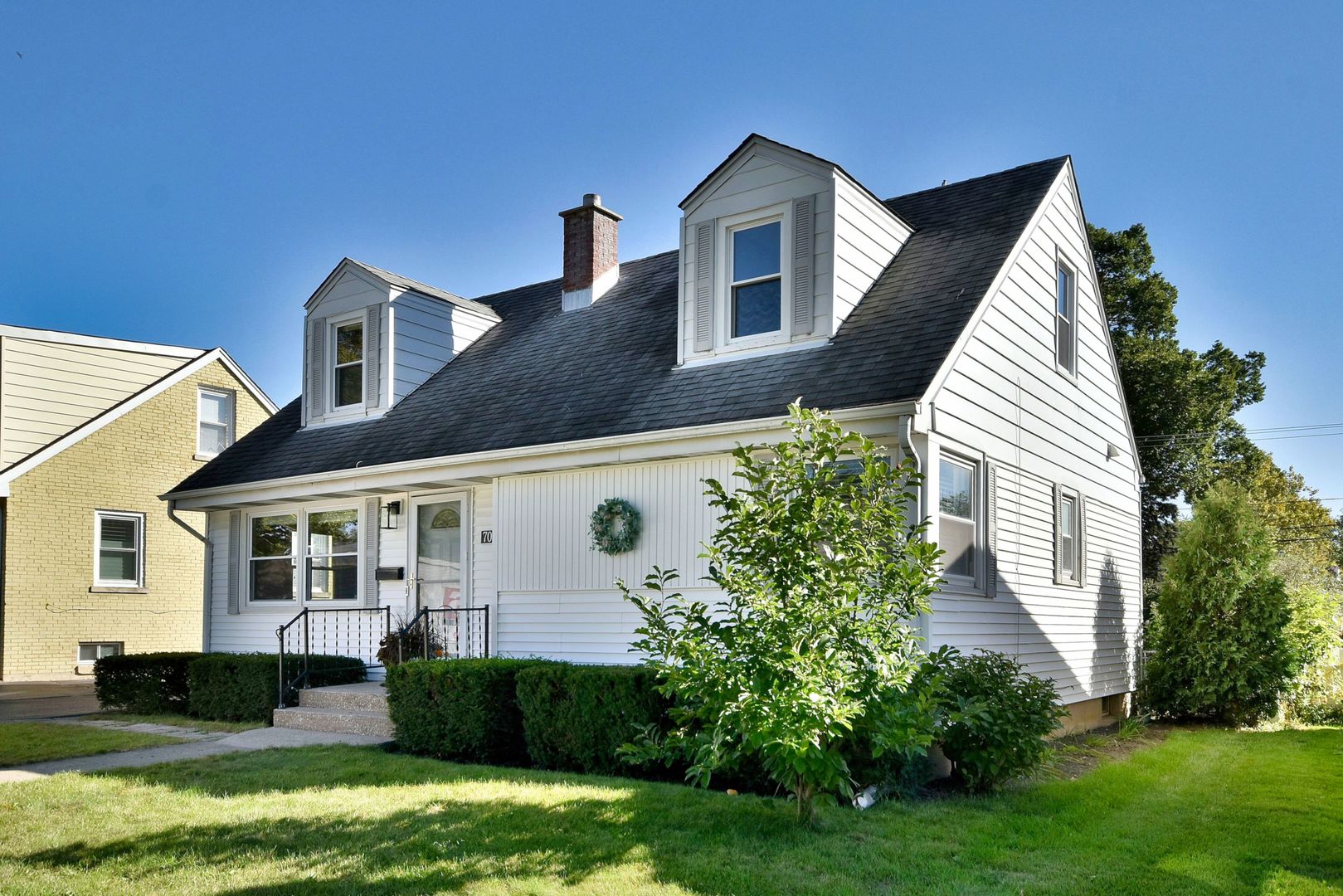 709 Spring Road Elmhurst, IL 60126 - Photo 2 of 42 a front view of a house with a yard