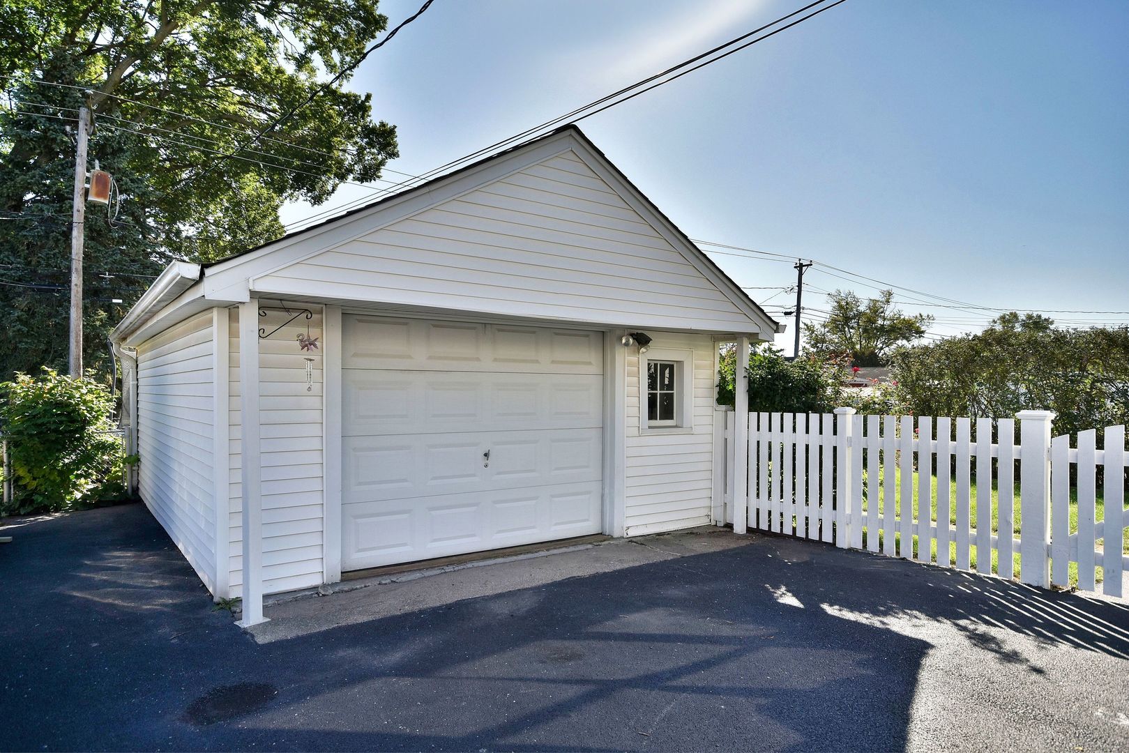 709 Spring Road Elmhurst, IL 60126 - Photo 39 of 42 a view of a small house with wooden fence