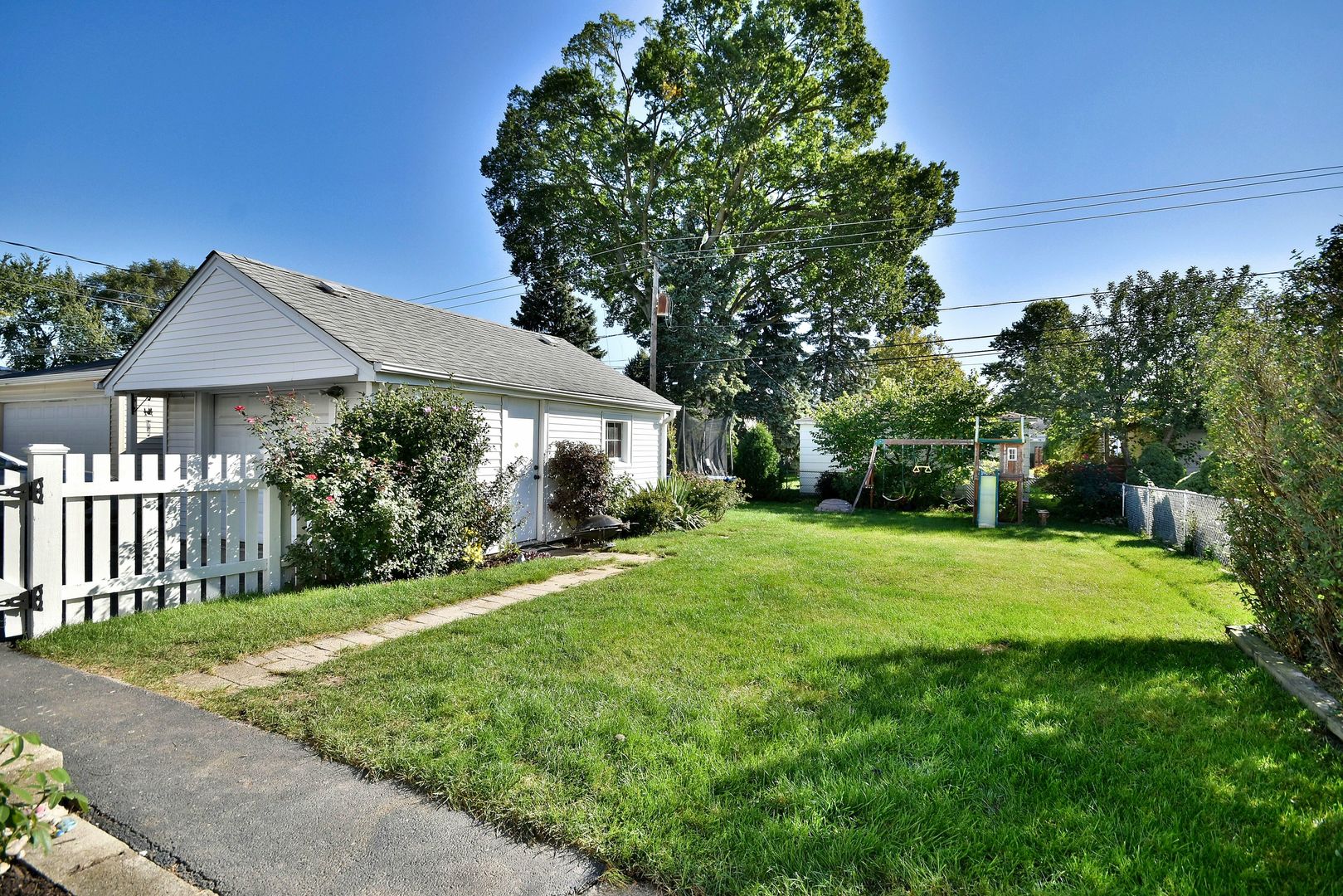 709 Spring Road Elmhurst, IL 60126 - Photo 41 of 42 a front view of a house with yard and green space