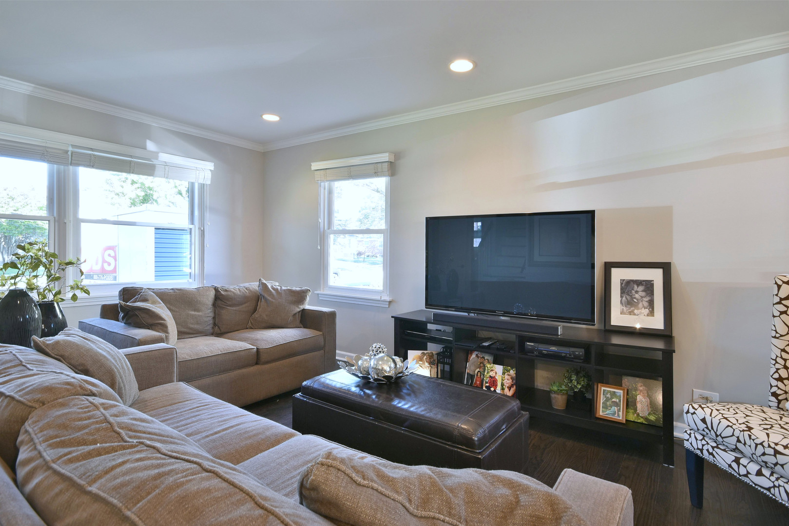 709 Spring Road Elmhurst, IL 60126 - Photo 10 of 42 a living room with furniture and a flat screen tv