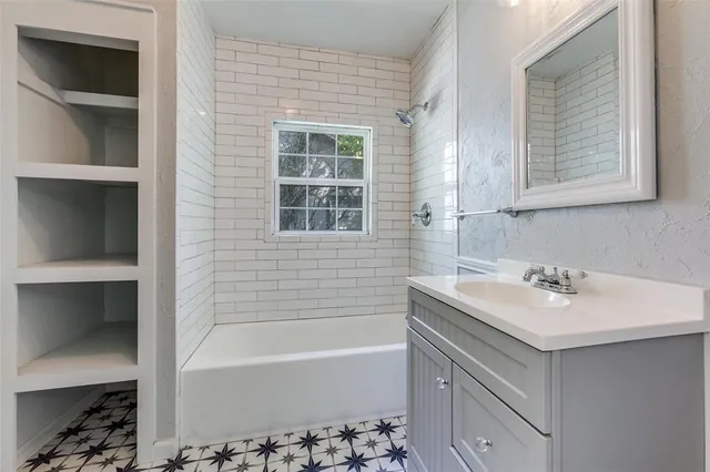 a bathroom with a sink and a bathtub
