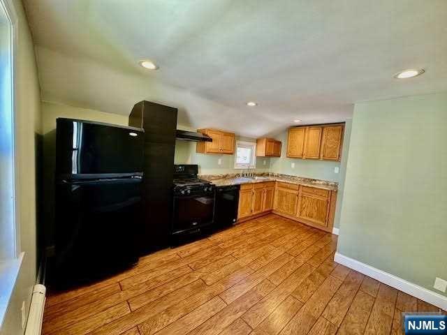 3 MacArthur Avenue Hasbrouck Heights, NJ 07604 - Photo 11 of 15 a kitchen with a refrigerator and a sink