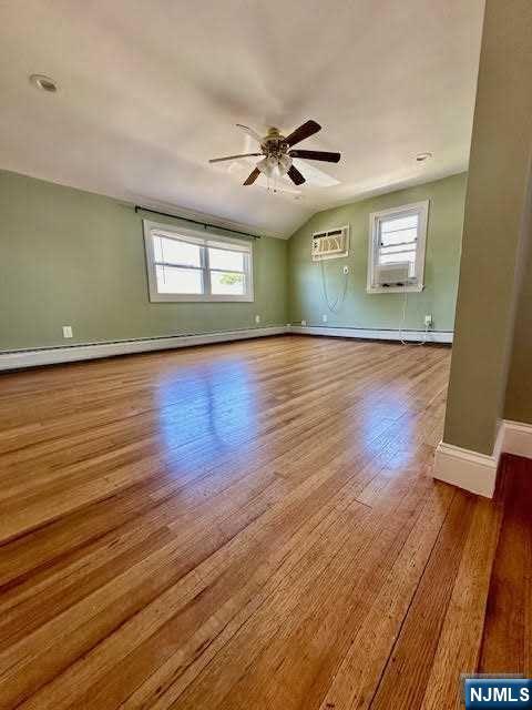 3 MacArthur Avenue Hasbrouck Heights, NJ 07604 - Photo 12 of 15 wooden floor in an empty room with a window