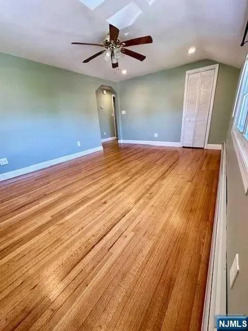 a view of a room with a wooden floor