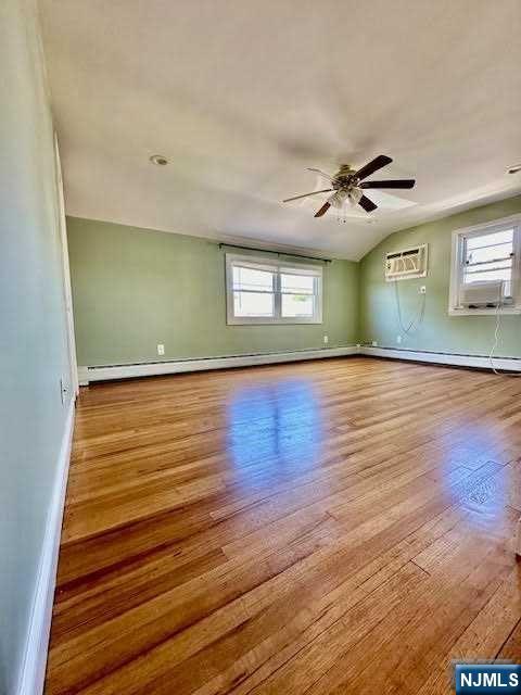 3 MacArthur Avenue Hasbrouck Heights, NJ 07604 - Photo 3 of 15 a view of room with window and wooden floor