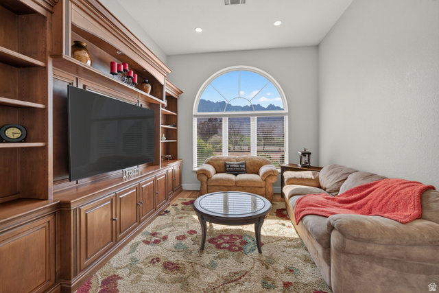 4297 Beeman Road Moab, UT 84532 - Photo 5 of 59 Built-in entertainment center featuring extensive wood cabinetry and shelving