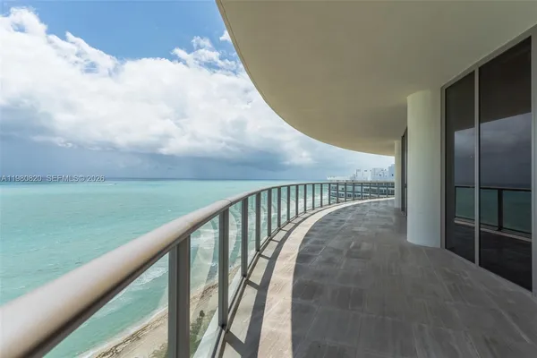 a view of a balcony with an ocean view