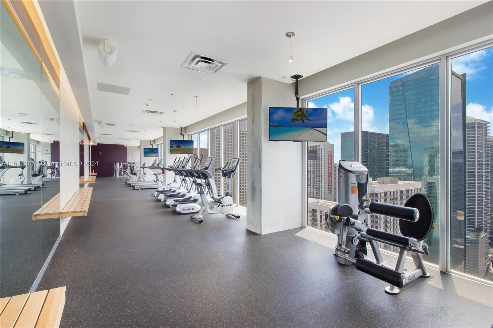 151 Southeast 1st Street, Unit 2109 Miami, FL 33131 - Photo 12 of 13 a view of a room with gym equipment
