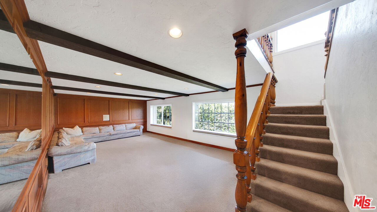 2312 Kimridge Road Beverly Hills, CA 90210 - Photo 46 of 60 a view of a livingroom with furniture and stairs