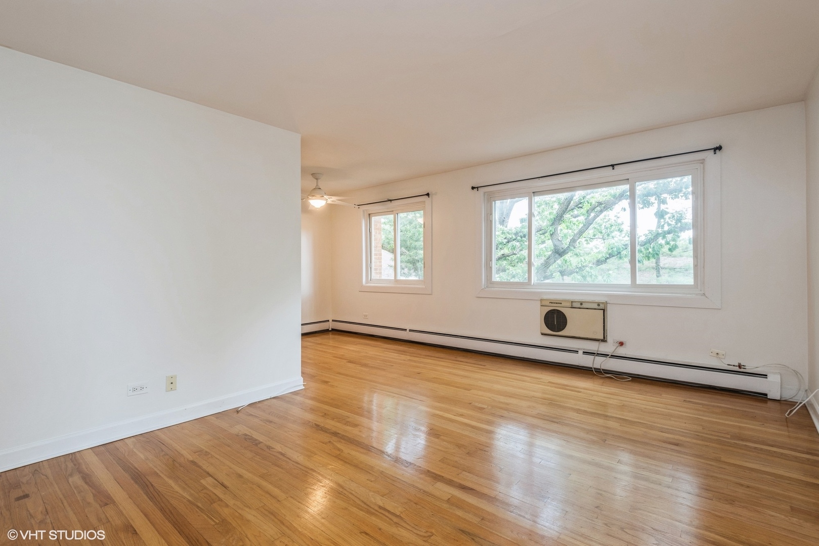820 Seward Street, Unit 3E Evanston, IL 60202 - Photo 12 of 24 an empty room with wooden floor and windows