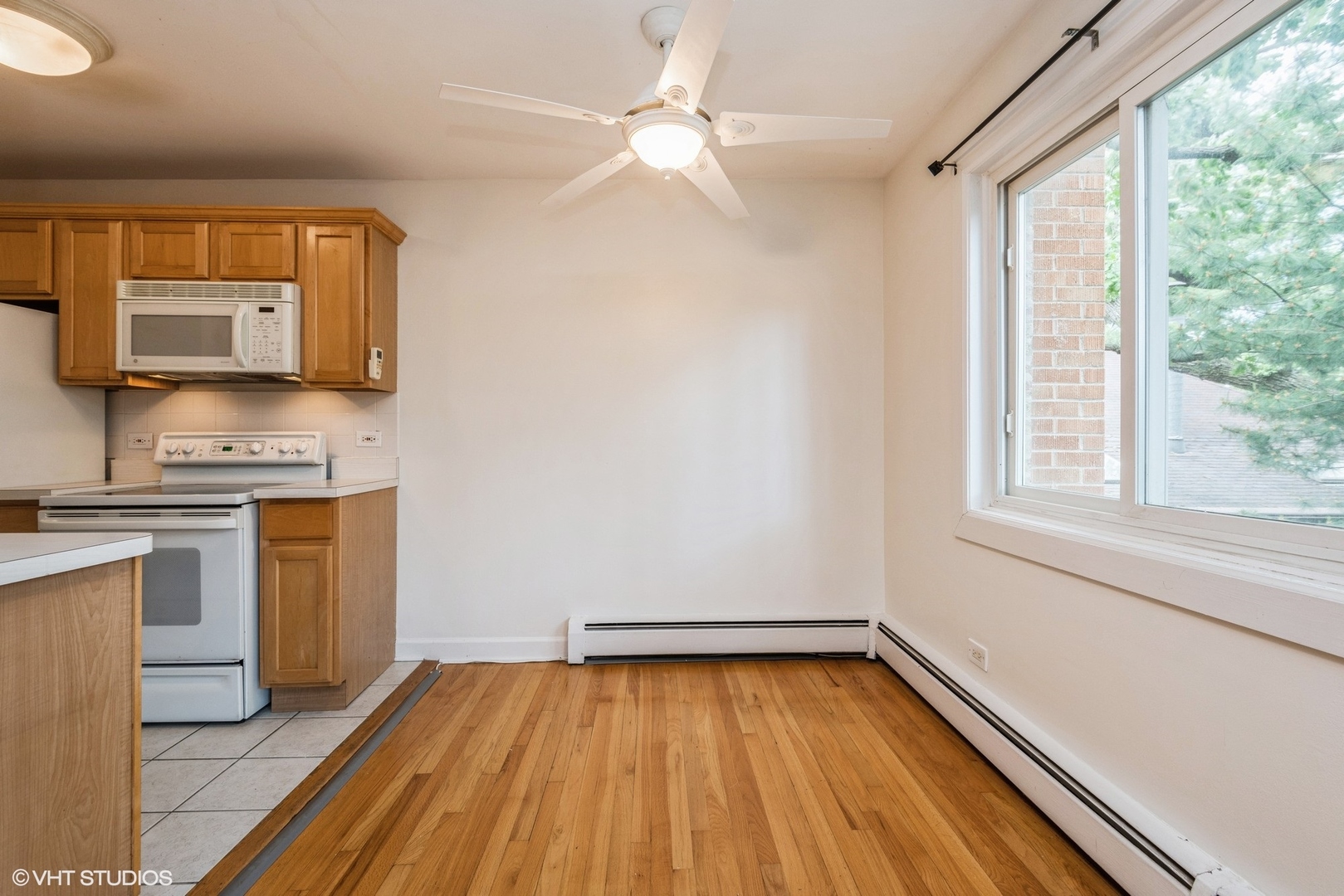820 Seward Street, Unit 3E Evanston, IL 60202 - Photo 9 of 24 a view of kitchen with sink and wooden floor