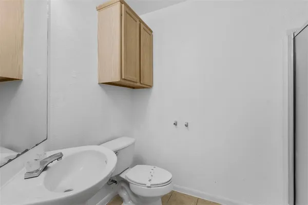 a bathroom with a sink and a toilet