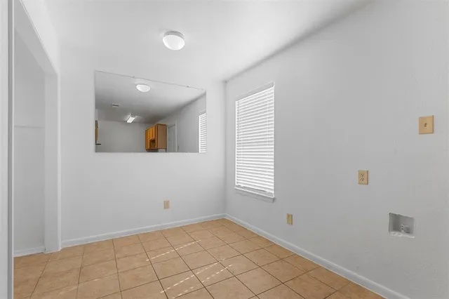 a view of an empty room and window