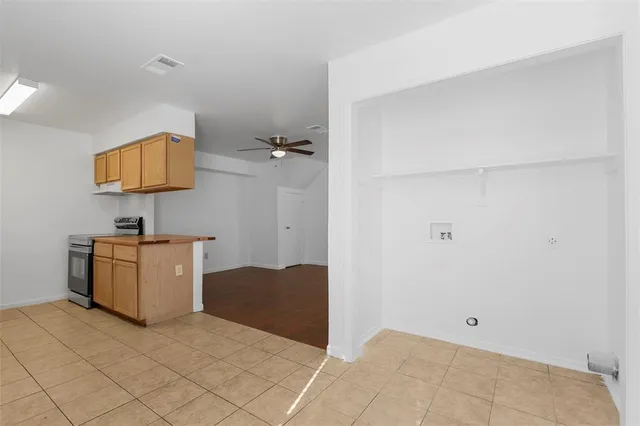 a bedroom with a bed and a lamp on table
