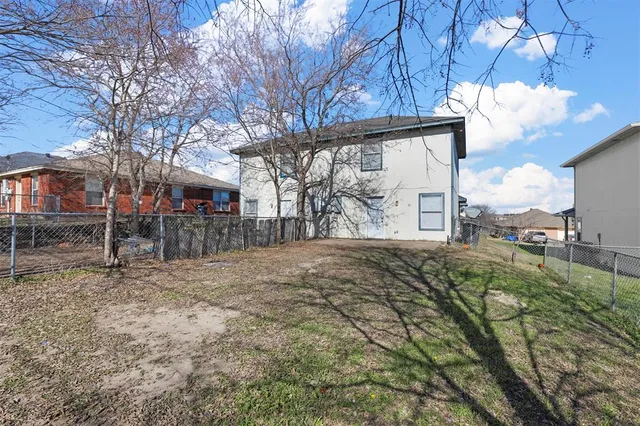 a view of street with large trees