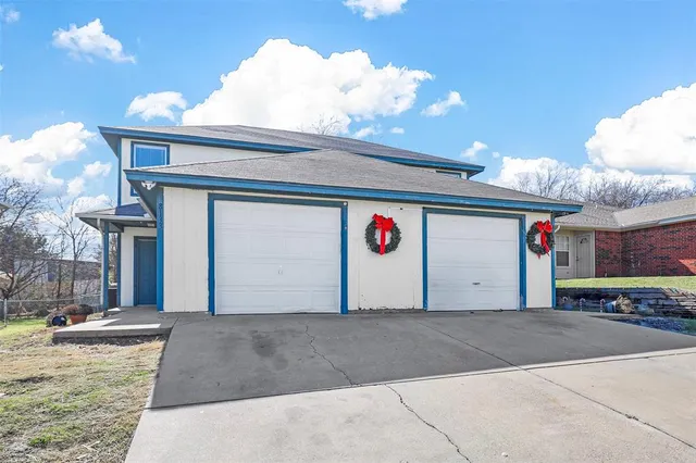 a front view of a building with parking