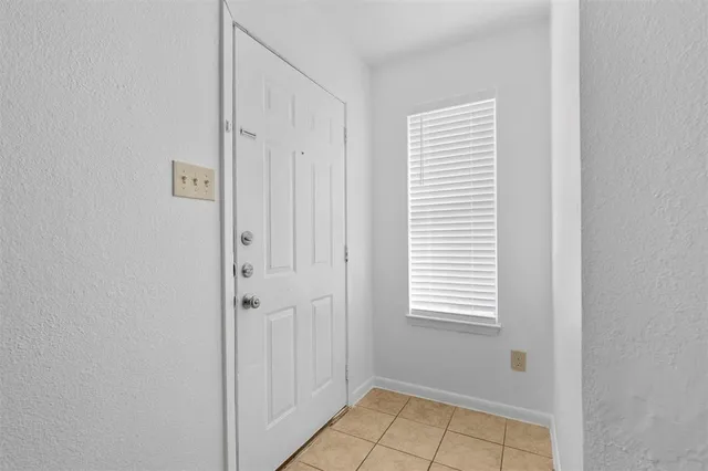 a view of a room that has a window in it