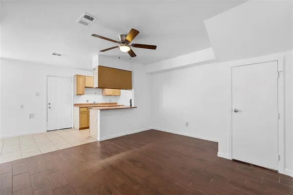a view of a kitchen with a sink and dishwasher