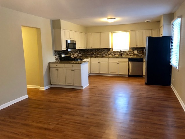 40 Valley Road Glen Ellyn, IL 60137 - Photo 12 of 24 a kitchen with granite countertop stainless steel appliances refrigerator sink and cabinets