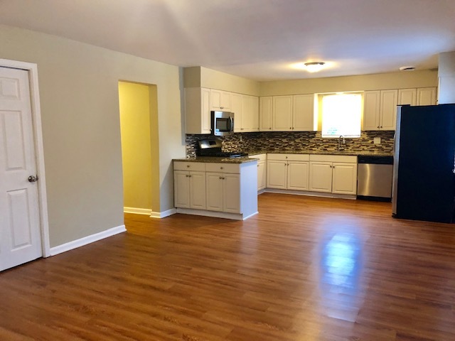 40 Valley Road Glen Ellyn, IL 60137 - Photo 13 of 24 a kitchen with a refrigerator and a stove top oven