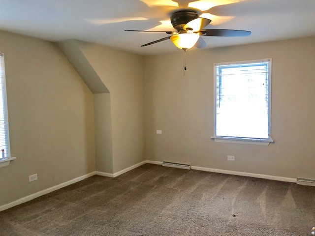 40 Valley Road Glen Ellyn, IL 60137 - Photo 20 of 24 an empty room with a window and a fan