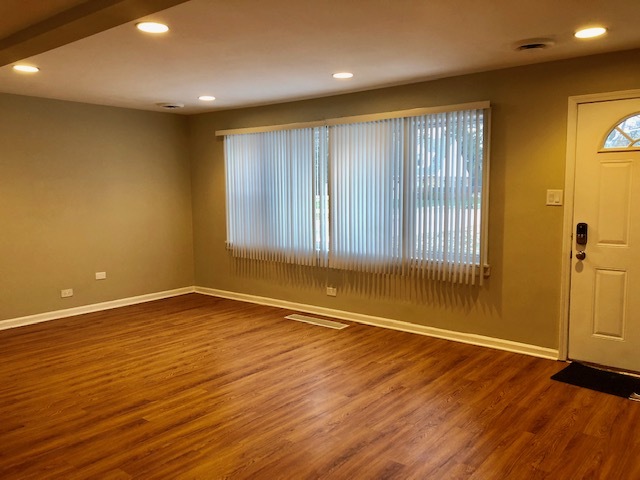 40 Valley Road Glen Ellyn, IL 60137 - Photo 21 of 24 an empty room with wooden floor and windows