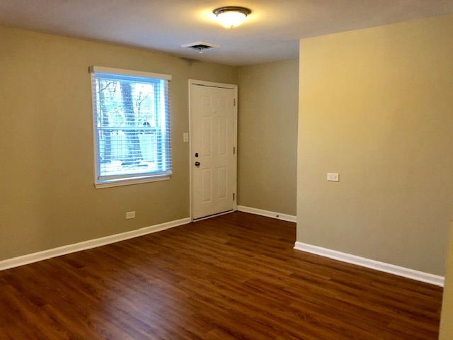 40 Valley Road Glen Ellyn, IL 60137 - Photo 10 of 24 an empty room with wooden floor and windows