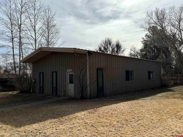a house with trees in the background