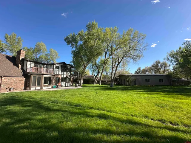 a view of a house with a big yard