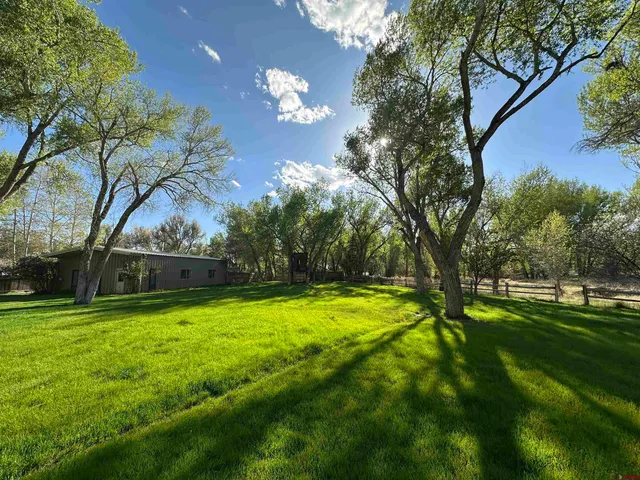 a view of swimming pool with an outdoor space and seating area