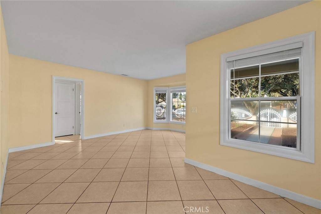 1104 Williamson Avenue Fullerton, CA 92833 - Photo 33 of 75 a view of an empty room with window and wooden floor