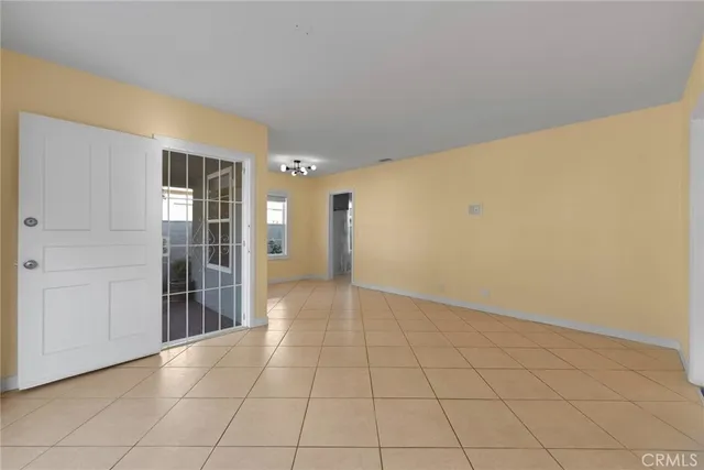 a kitchen with granite countertop white cabinets and a stove