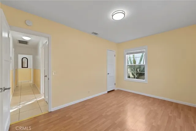 a kitchen with cabinets and appliances