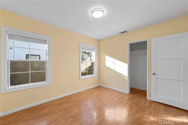 a kitchen with granite countertop a stove a sink and a refrigerator