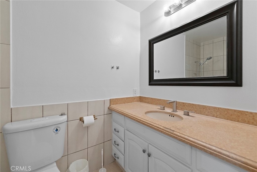 1104 Williamson Avenue Fullerton, CA 92833 - Photo 40 of 75 a bathroom with a sink and a mirror