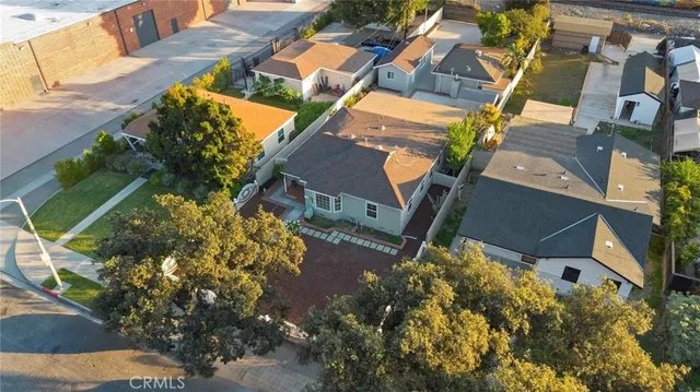 an aerial view of a house with garden space and sitting space