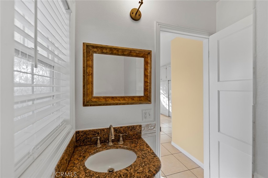 1104 Williamson Avenue Fullerton, CA 92833 - Photo 47 of 75 a bathroom with a sink and a mirror