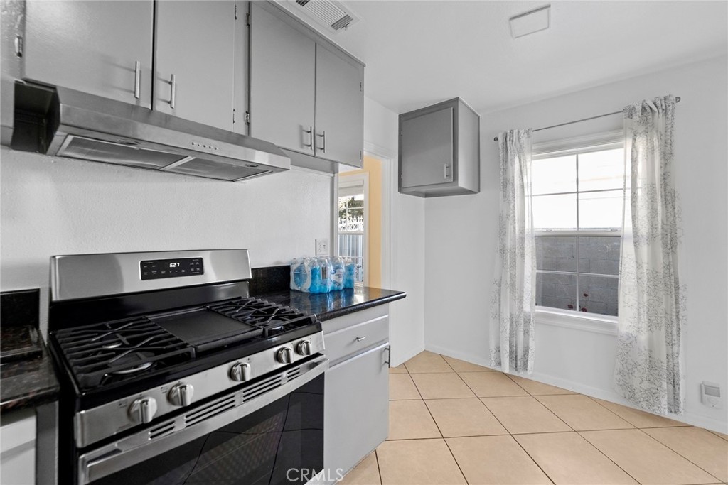 1104 Williamson Avenue Fullerton, CA 92833 - Photo 56 of 75 a kitchen with cabinets and appliances
