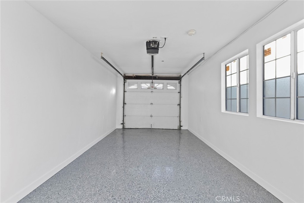 1104 Williamson Avenue Fullerton, CA 92833 - Photo 68 of 75 an empty room with windows and ceiling fan