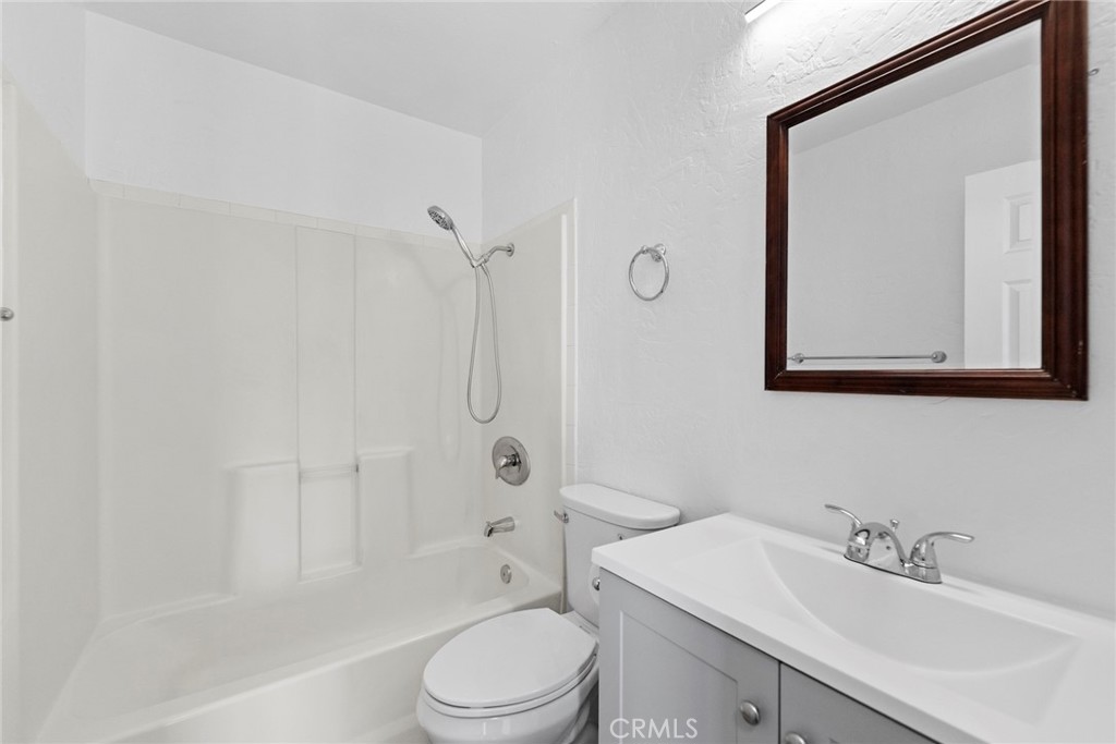 1104 Williamson Avenue Fullerton, CA 92833 - Photo 74 of 75 a bathroom with a toilet a sink and a mirror