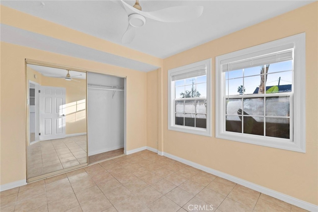 1104 Williamson Avenue Fullerton, CA 92833 - Photo 75 of 75 an empty room with large windows and a livingroom