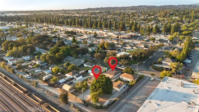 an aerial view of houses with an outdoor space