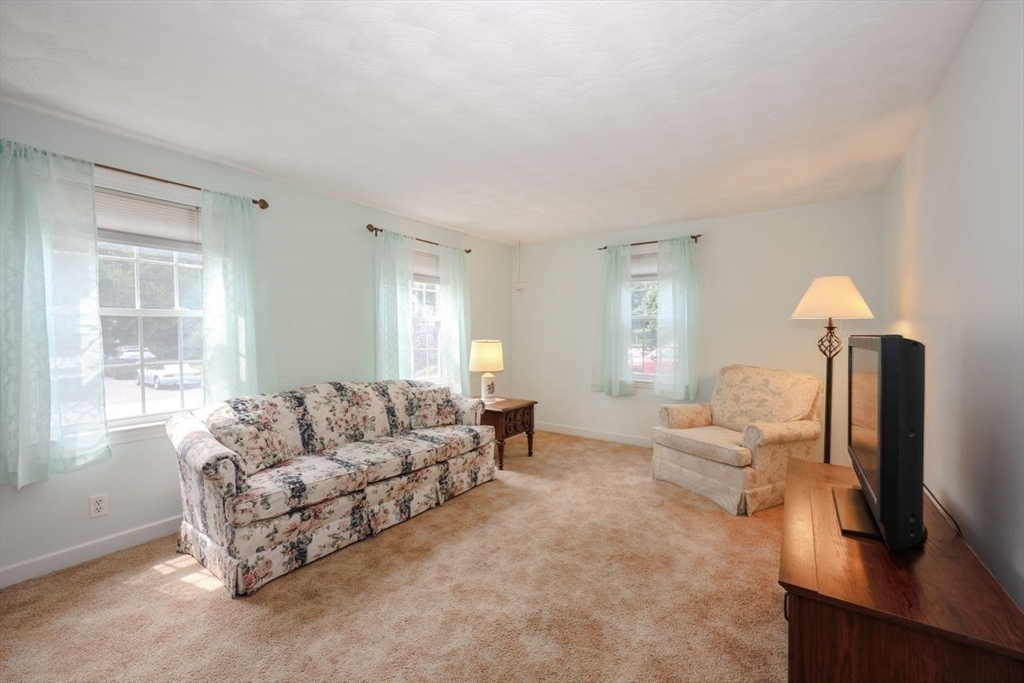 35 Walnut Road Chelmsford, MA 01824 - Photo 12 of 42 a living room with furniture and a flat screen tv
