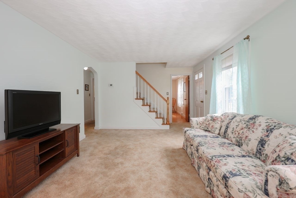 35 Walnut Road Chelmsford, MA 01824 - Photo 13 of 42 a living room with furniture and a flat screen tv