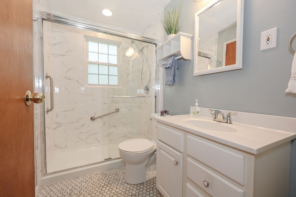 35 Walnut Road Chelmsford, MA 01824 - Photo 16 of 42 a bathroom with a sink toilet and shower