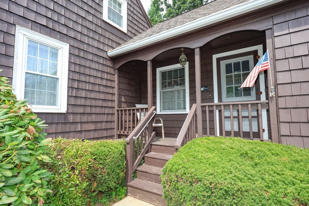 35 Walnut Road Chelmsford, MA 01824 - Photo 2 of 42 a view of a house with a small yard and wooden floor and fence